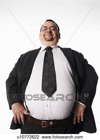 Overweight smiling businessman with hands on hips View Large Photo Image Stock Image - Overweight smiling businessman with hands on hips. Fotosearch
