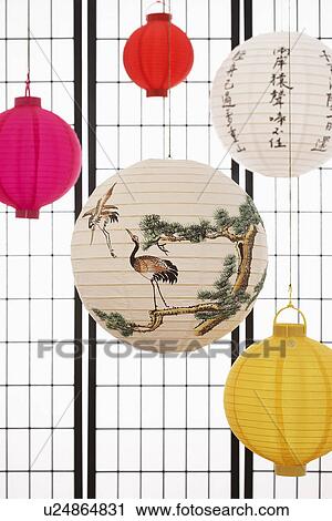 Stock Image - Paper lanterns hanging against paper screen. Fotosearch