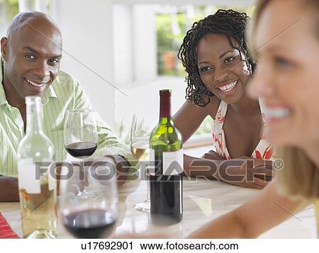 People at table laughing View Large Photo Image Stock Image - People at table laughing. Fotosearch