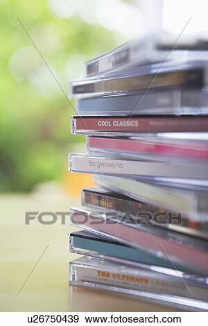 Pile of CD jewel cases on table close-up View Large Photo Image Stock Photo - Pile of CD jewel cases on table close-up. Fotosearch