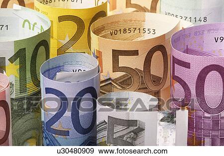 Stock Photo - Rolled up Euro banknotes. Fotosearch