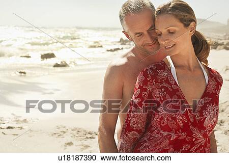 Romantic couple on beach smiling View Large Photo Image Stock Image - Romantic couple on beach smiling. Fotosearch
