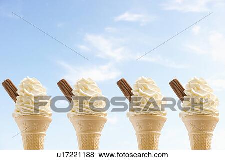 Row of four icecreams against sky View Large Photo Image Stock Photo - Row of four icecreams against sky. Fotosearch