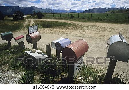 Stock Image - Row of mailboxes in non-urban setting. Fotosearch