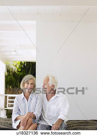 Senior couple sitting on verandah portrait View Large Photo Image Stock Photograph - Senior couple sitting on verandah portrait. Fotosearch