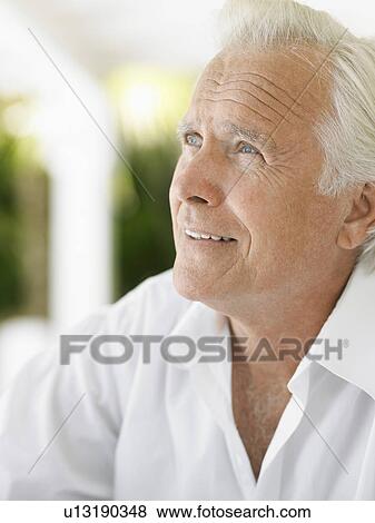 Senior man looking up and smiling View Large Photo Image Stock Photo - Senior man looking up and smiling. Fotosearch