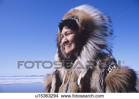 Picture - Smiling Eskimo Woman in Traditional Clothing. Fotosearch
