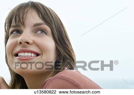 Stock Image - Smiling woman close-up. Fotosearch