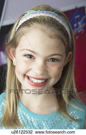Stock Image - Smiling Young Girl close-up. Fotosearch