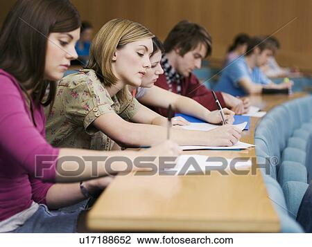 Stock Image - Students in lecture room. Fotosearch