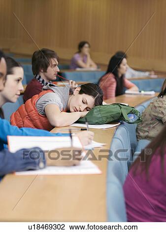 Stock Image - Students in lecture room. Fotosearch