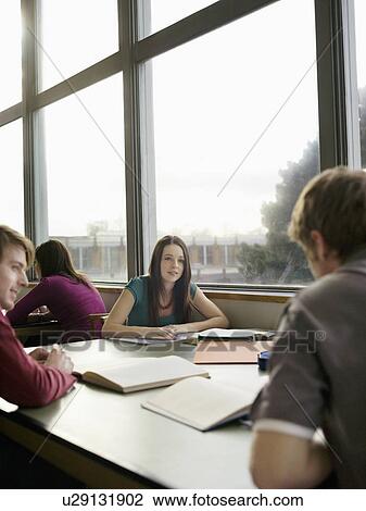 Stock Image - Students in reading room. Fotosearch