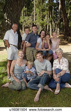 Three children (7-9) with family near forest portrait. View Large Photo Image Picture - Three children (7-9) with family near forest portrait.. Fotosearch