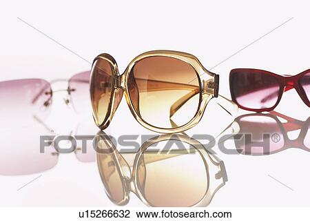 Three pairs of sunglasses studio shot View Large Photo Image Stock Image - Three pairs of sunglasses studio shot. Fotosearch