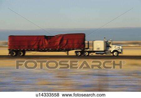 Truck on road in desert View Large Photo Image Stock Photo - Truck on road in desert. Fotosearch