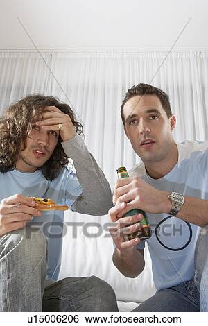 Two Anxious Men Watching Television View Large Photo Image Stock Photograph - Two Anxious Men Watching Television. Fotosearch