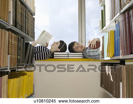 Stock Photography - Two College Students Reading in Library. Fotosearch