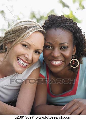 Two women laughing portrait View Large Photo Image Stock Photo - Two women laughing portrait. Fotosearch