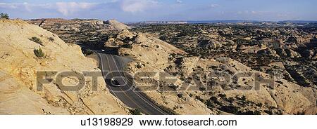 Stock Photo - USA Utah car on road through desert. Fotosearch