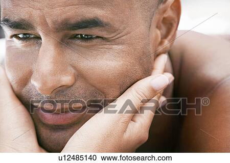 Woman cupping man's face in hands close up View Large Photo Image Stock Image - Woman cupping man's face in hands close up. Fotosearch