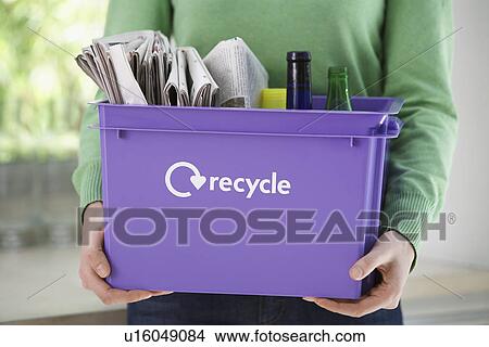 Woman holding recycle container mid section View Large Photo Image Picture - Woman holding recycle container mid section. Fotosearch