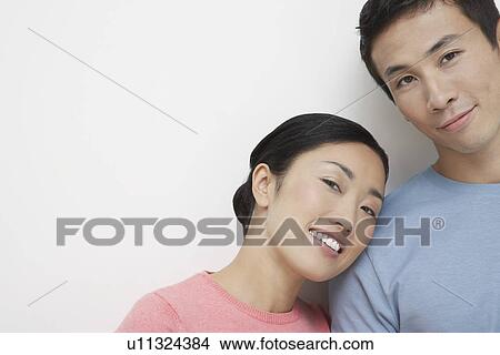 Picture - Woman Leaning Her Head on Boyfriend's Shoulder. Fotosearch