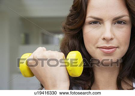Woman lifting weight head and shoulders View Large Photo Image Stock Image - Woman lifting weight head and shoulders. Fotosearch