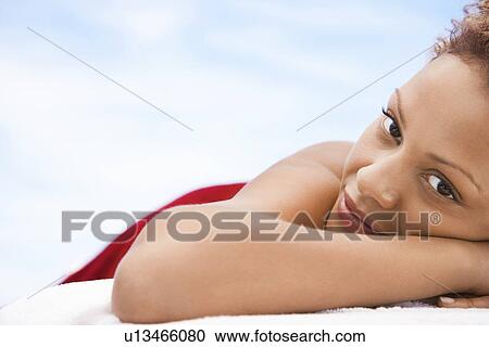 Woman lying on massage table head and shoulders close up View Large Photo Image Stock Image - Woman lying on massage table head and shoulders close up. Fotosearch