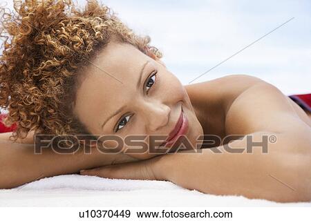 Woman lying on massage table head and shoulders View Large Photo Image Stock Photo - Woman lying on massage table head and shoulders. Fotosearch