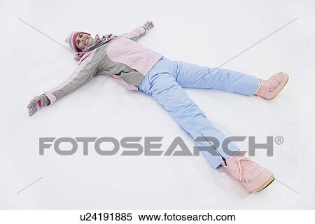 Woman lying on snow elevated view portrait View Large Photo Image Stock Photography - Woman lying on snow elevated view portrait. Fotosearch