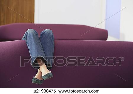 Woman Relaxing upside down on Sofa low section View Large Photo Image Stock Photography - Woman Relaxing upside down on Sofa low section. Fotosearch