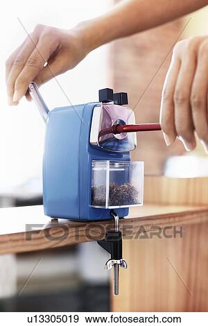 Woman using manual pencil sharpener close-up. View Large Photo Image Stock Photo - Woman using manual pencil sharpener close-up.. Fotosearch