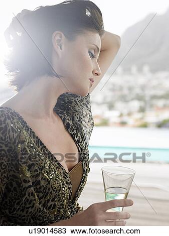 Woman with champagne glass outdoors near mountains View Large Photo Image Stock Image - Woman with champagne glass outdoors near mountains. Fotosearch
