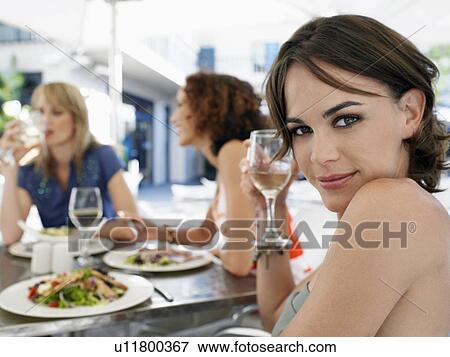Woman with friends at outdoor cafe portrait View Large Photo Image Stock Photo - Woman with friends at outdoor cafe portrait. Fotosearch