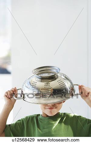 Young boy with colander on head head and shoulders View Large Photo Image Stock Photo - Young boy with colander on head head and shoulders. Fotosearch