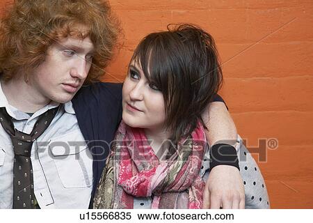 Young couple embracing and looking in eyes View Large Photo Image Stock Photography - Young couple embracing and looking in eyes. Fotosearch
