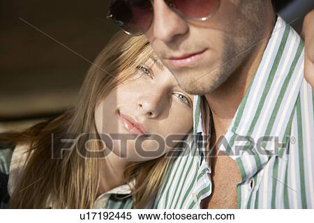 Young couple embracing head and shoulders View Large Photo Image Stock Photography - Young couple embracing head and shoulders. Fotosearch