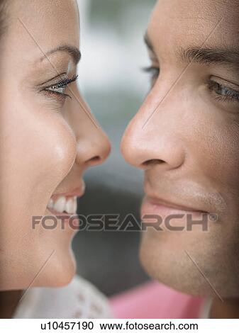 Stock Image - Young Couple Face to Face. Fotosearch