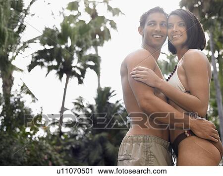 Young Couple Hugging Outdoors View Large Photo Image Stock Image - Young Couple Hugging Outdoors. Fotosearch
