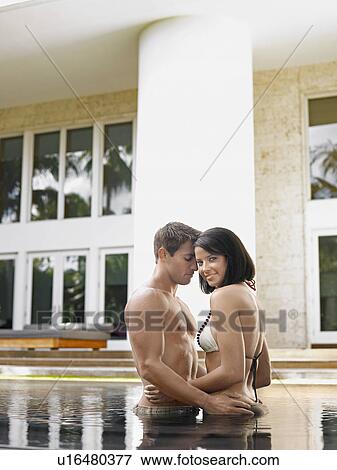 Young Couple in Swimming Pool View Large Photo Image Stock Photo - Young Couple in Swimming Pool. Fotosearch