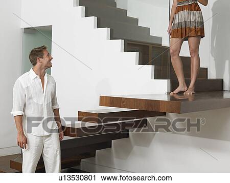 Stock Image - Young Couple on Stairs. Fotosearch