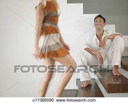 Stock Image - Young Couple on Stairs. Fotosearch
