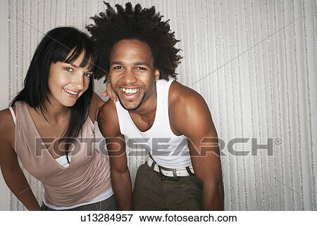 Young couple smiling portrait View Large Photo Image Stock Photo - Young couple smiling portrait. Fotosearch