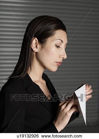 Young elegant woman opening letter View Large Photo Image Stock Photograph - Young elegant woman opening letter. Fotosearch