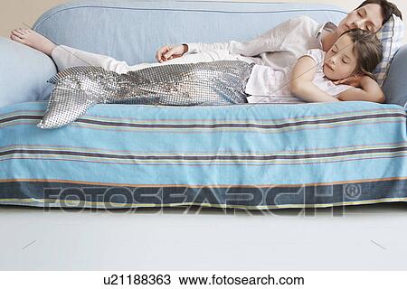 Young girl (5-6) wearing mermaid costume sleeping on sofa with mother View Large Photo Image Stock Image - Young girl (5-6) wearing mermaid costume sleeping on sofa with mother. Fotosearch