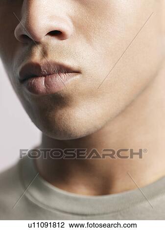 Stock Image - Young man close-up of mouth. Fotosearch