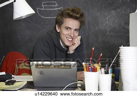Stock Image - Young man in studio. Fotosearch