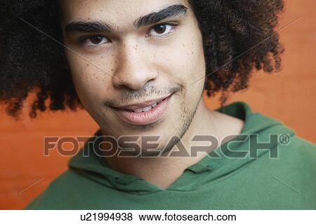 Stock Photo - Young man smiling close-up. Fotosearch