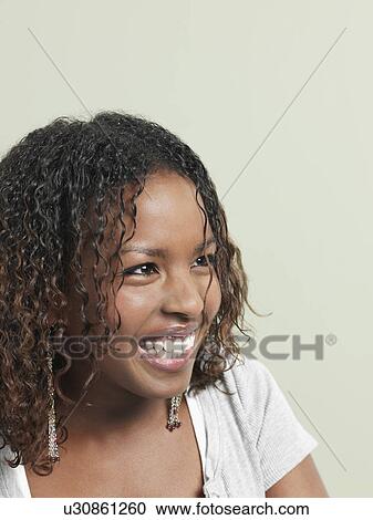 Young woman laughing close-up View Large Photo Image Stock Image - Young woman laughing close-up. Fotosearch