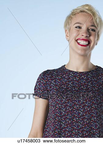 Young woman looking away and laughing View Large Photo Image Stock Image - Young woman looking away and laughing. Fotosearch